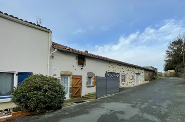 Facade of guest room and adjoining gîte. Private road._5
